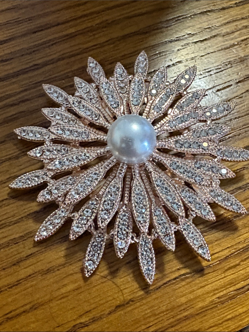 Pearl-Centered Rose Gold tone Sunburst Brooch with Clear Rhinestones